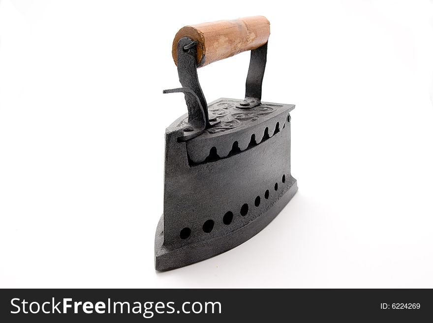 An old iron in a white background. An old iron in a white background