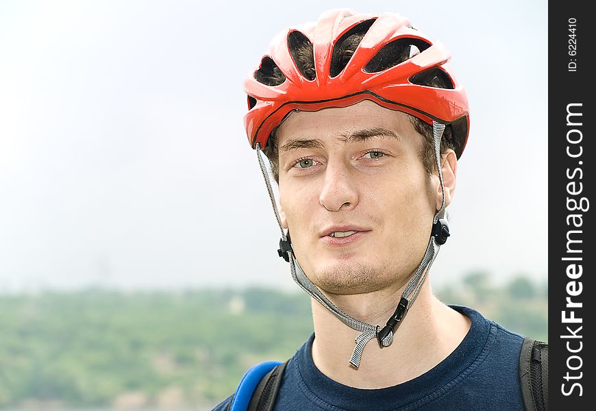 Portrait of cyclist in the protective helmet