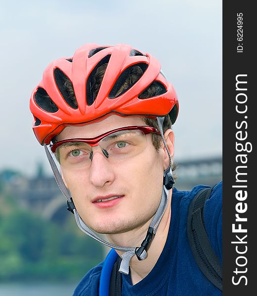 Portrait of cyclist in the protective helmet