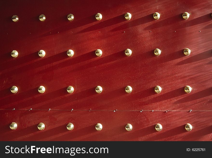 Ancient wall decorated with gold button. Ancient wall decorated with gold button