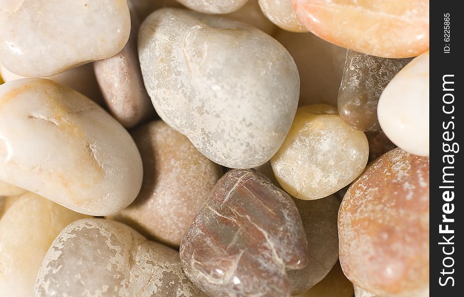 Closeup of a pile of sea pebbles (as a background)