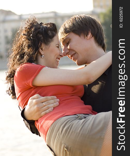 Outdoor portrait of happy young couple