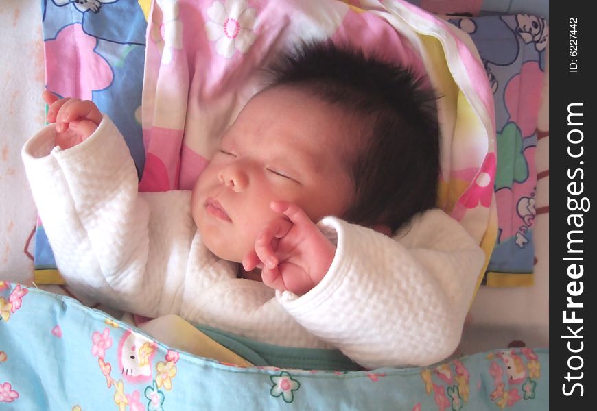 Sleeping Baby on a bed