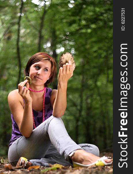 Beautiful student holding the mushroom in her hands. Beautiful student holding the mushroom in her hands.