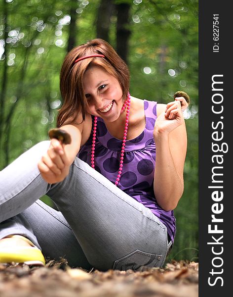 Beautiful student holding the mushroom in her hands.This high resolution image was taken by 10 mp Canon camera with professional lens. Beautiful student holding the mushroom in her hands.This high resolution image was taken by 10 mp Canon camera with professional lens.