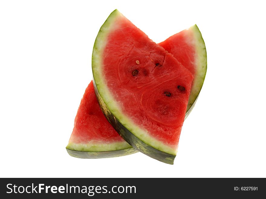 Watermelon is cut to slices isolated on white background