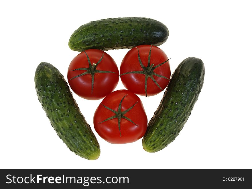 Tomatoes and cucumbers arranged isolated on white background