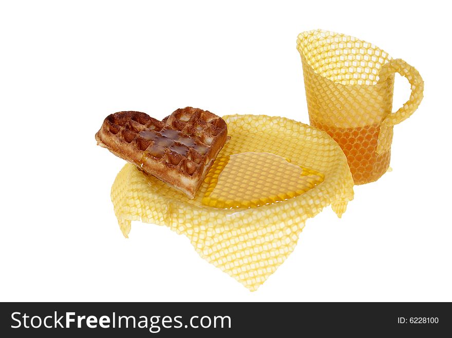 Waffle with honey on table isolated on white background. Waffle with honey on table isolated on white background