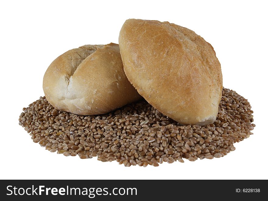 Fresh roll on wheat's grain isolated on white background