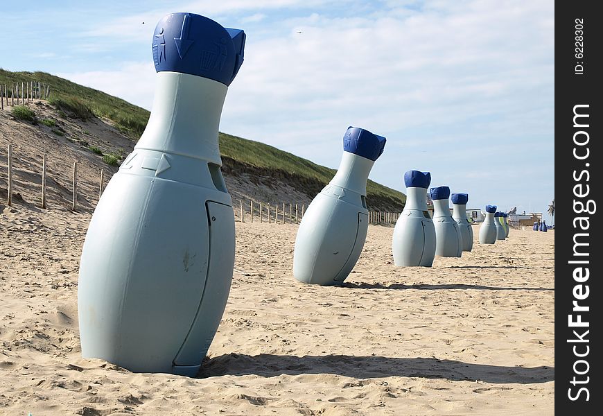 Garbage bottles on the beach in Holland in line. Garbage bottles on the beach in Holland in line