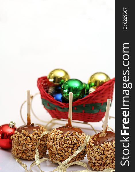 Holiday caramel apples vertical isolated on white