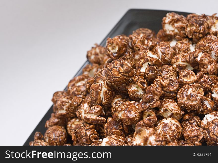 Brown color chocolate popcorn on neutral background