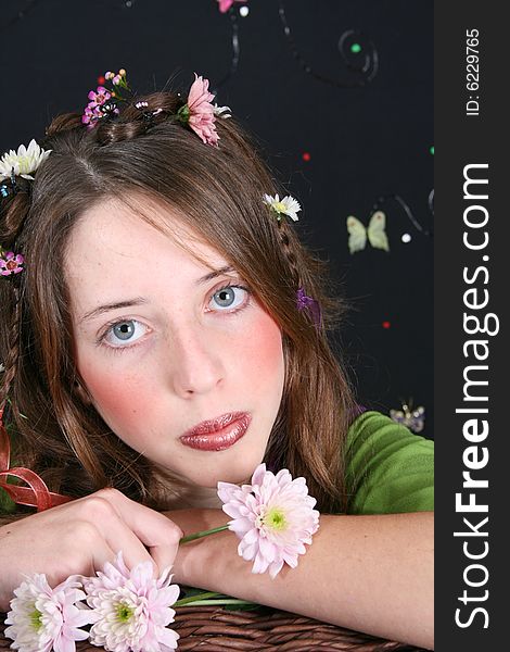 Teenage model with flowers and butterflies in her hair. Teenage model with flowers and butterflies in her hair