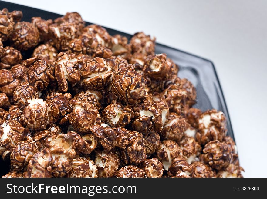 Brown color chocolate popcorn on neutral background