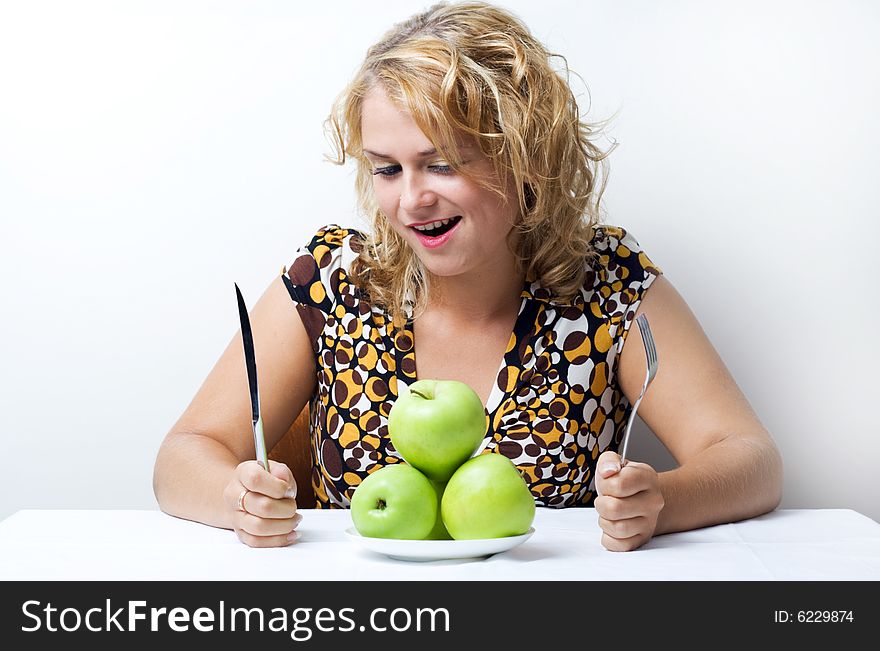 Young cute girl with green apples. Young cute girl with green apples.