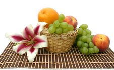Flower Of A Lily And Fruit Royalty Free Stock Photography