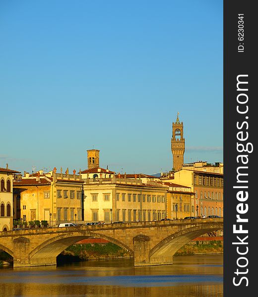 A suggestive shot of monuments and bridges on the Arno river in Florence at the sunset hour. A suggestive shot of monuments and bridges on the Arno river in Florence at the sunset hour