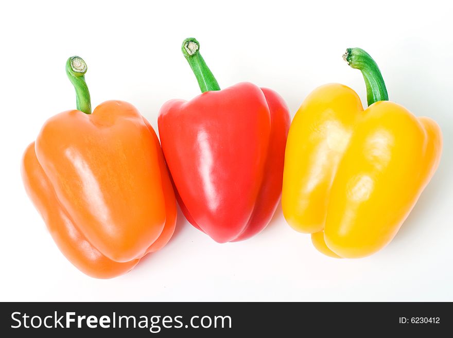 Orange red and yellow bell pepper.