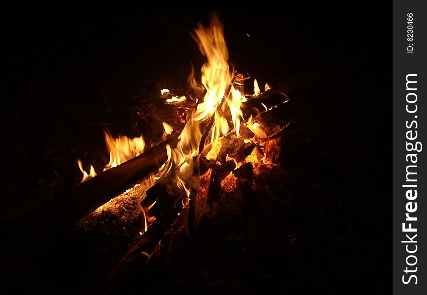 Burning firewood in the dark