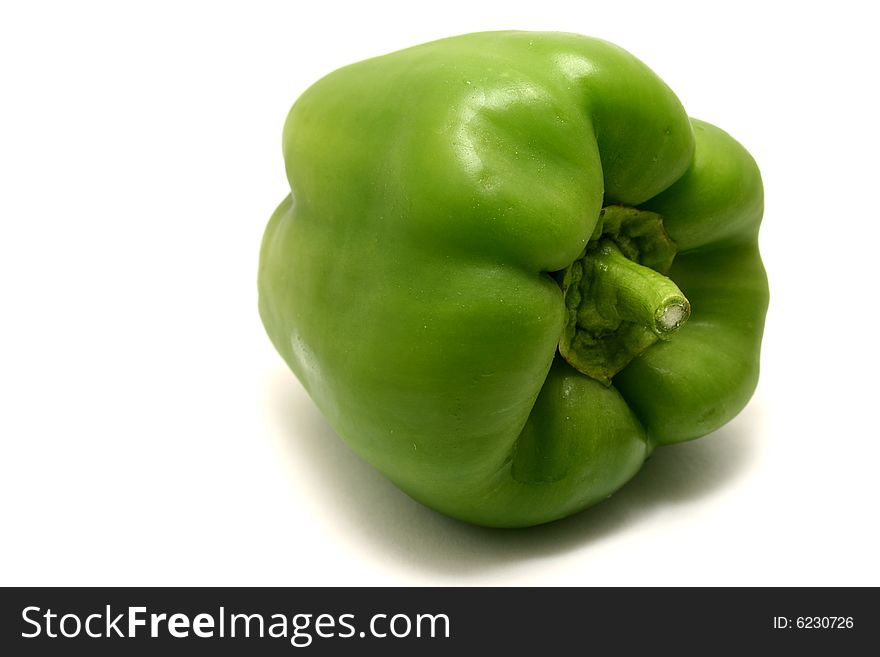 A green bell pepper isolated on a white background.