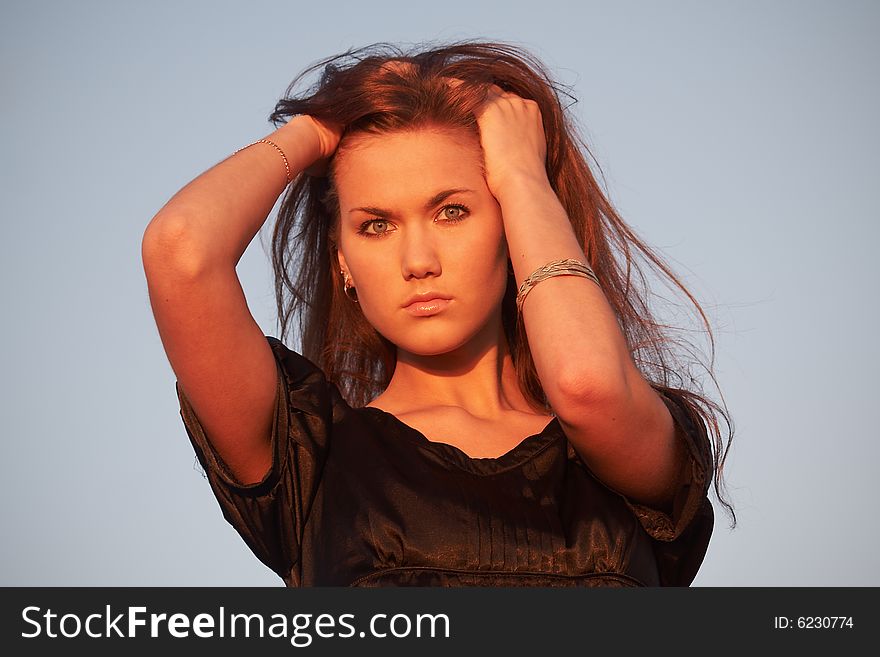 Portrait of a young lady in light of the evening sun