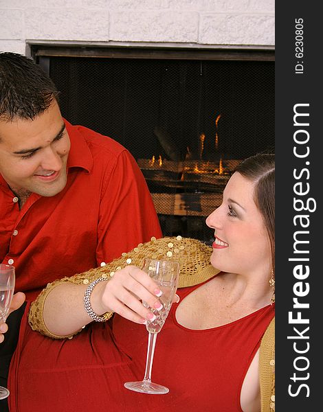 Shot of a romantic couple by fireplace vertical upclose