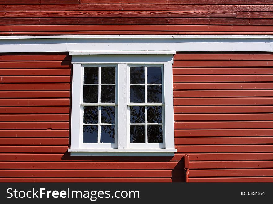 White Framed Window on a Red Barn. White Framed Window on a Red Barn