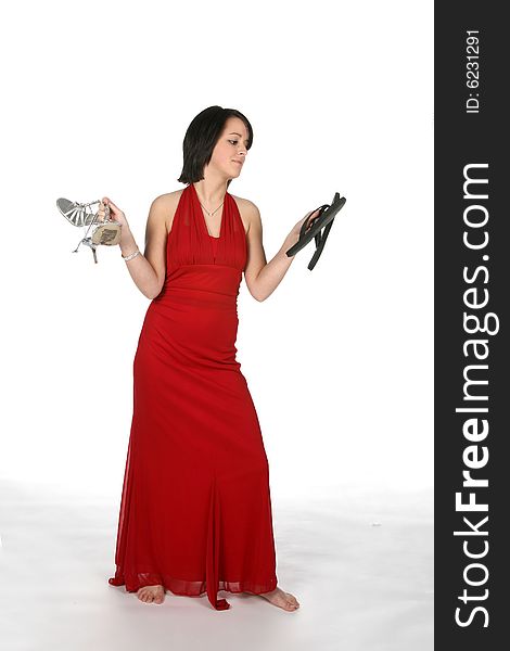 Teen in gown looking at shoes