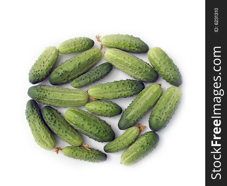 Green cucumbers on a white background