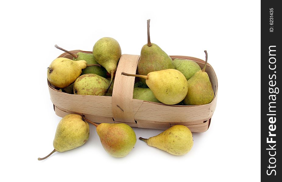 Ripe pears on a white 
background in a light basket