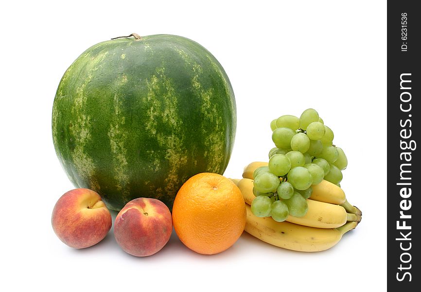 Green striped ripe 
watermelon and fruit on a white background