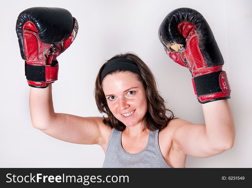 Boxing young women on light background