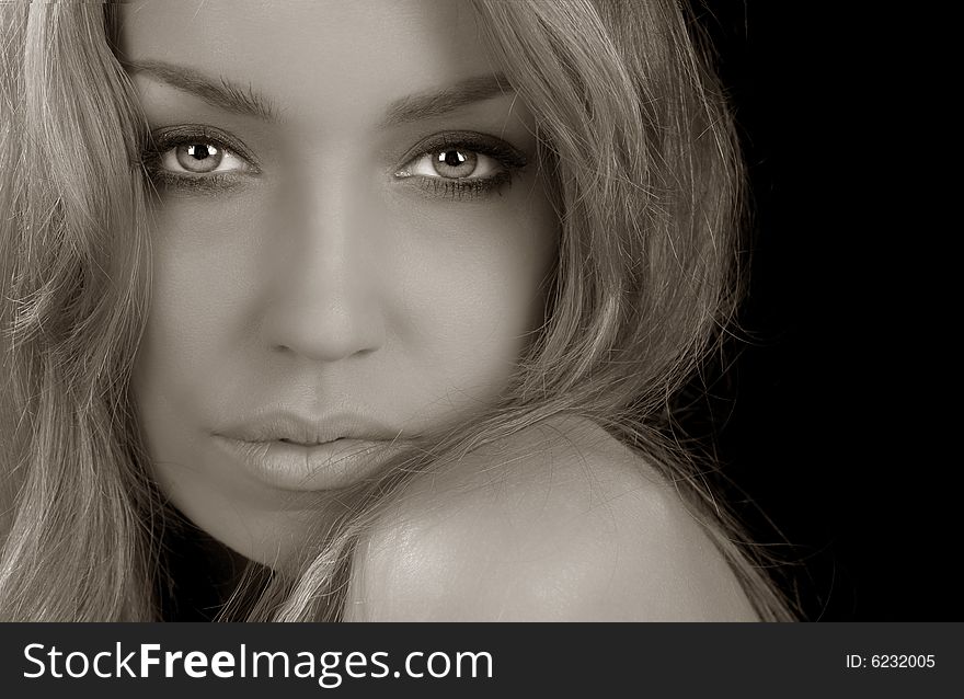 Close up portrait of a Beautiful Woman on Black