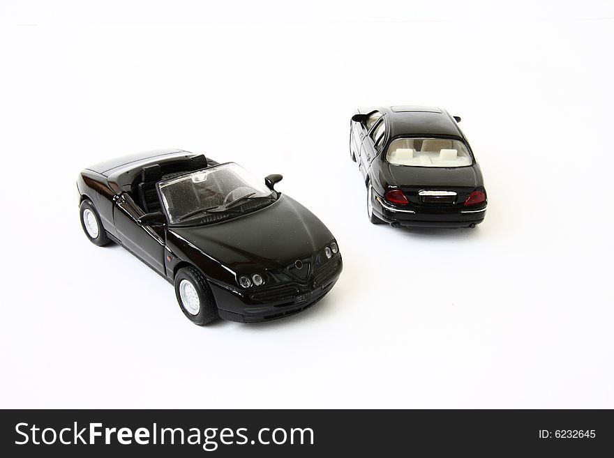 Two black cars isolated on white