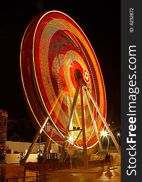 Shone Ferris wheel at night fair of amusements. Shone Ferris wheel at night fair of amusements