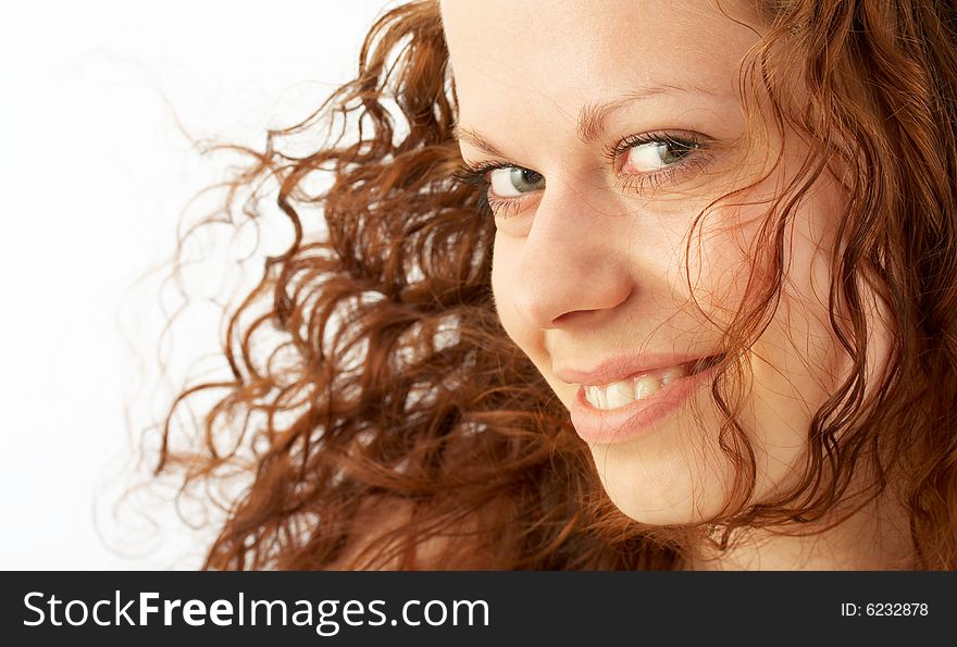 Portrait of the beautiful smiling girl with a flying hair. Portrait of the beautiful smiling girl with a flying hair