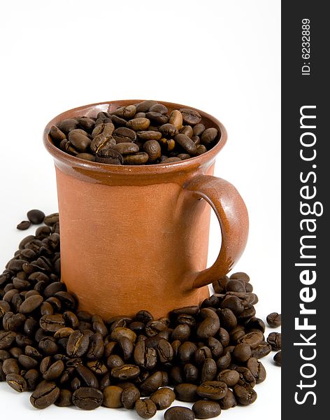 Roasted coffee and cup, white background. Roasted coffee and cup, white background.