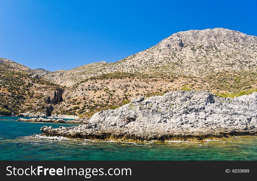 Rocky Mediterranean Beach. Samos Island, Greece.