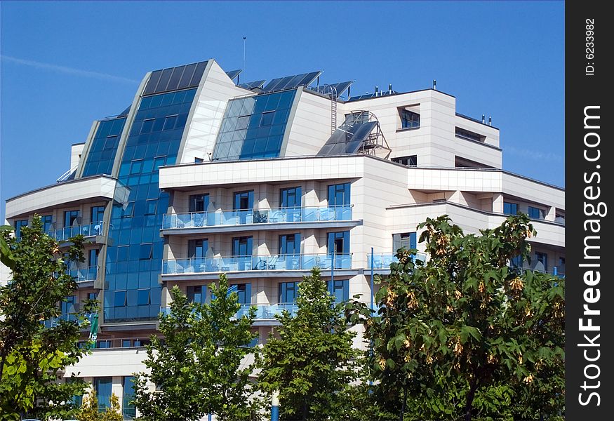 Modern blue building and green trees. Modern blue building and green trees