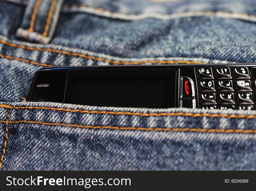 The blackberry cell phone  with the jean background. The blackberry cell phone  with the jean background