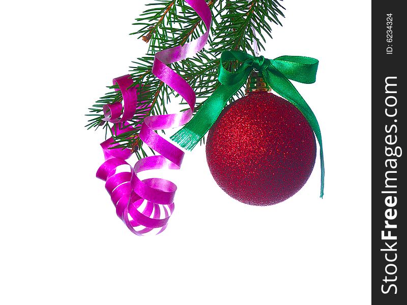 Red ball on fir branch with ribbons and bow isolated on white