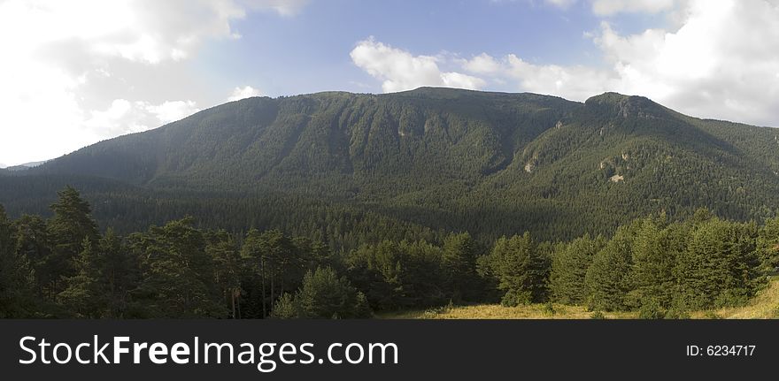 Panorama of a part of Rila mountain, Bulgaria on a sunny summer morning.