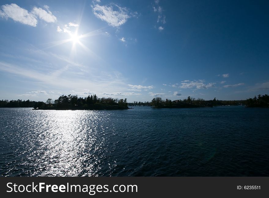 Blazing sun above Saint Lawrence River in thousand islands district. Blazing sun above Saint Lawrence River in thousand islands district