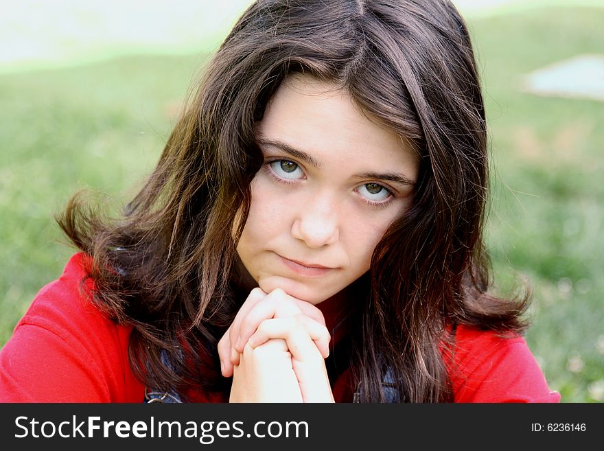 Young brunette teen girl lookin up praying. Young brunette teen girl lookin up praying