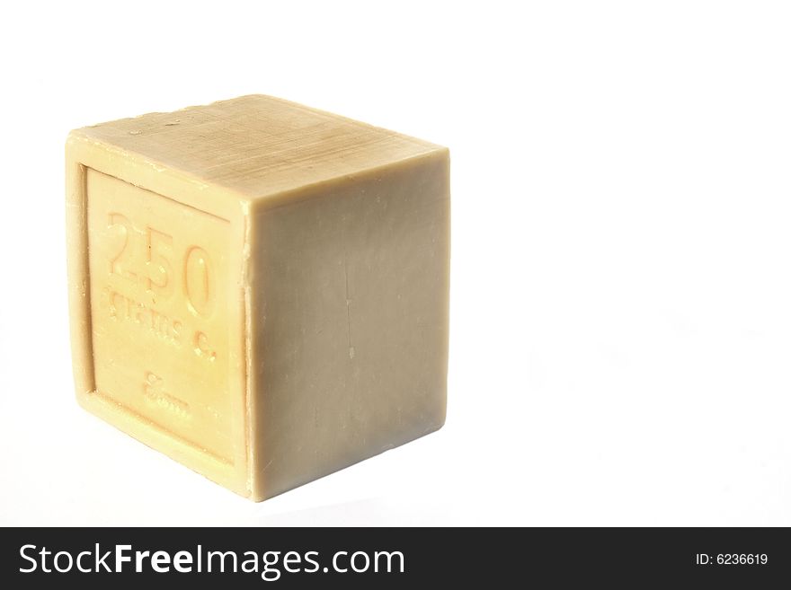 Square block of natural soap isolated against white background. Square block of natural soap isolated against white background