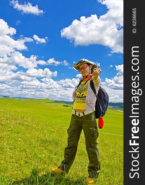 Happy girl on meadow,sky