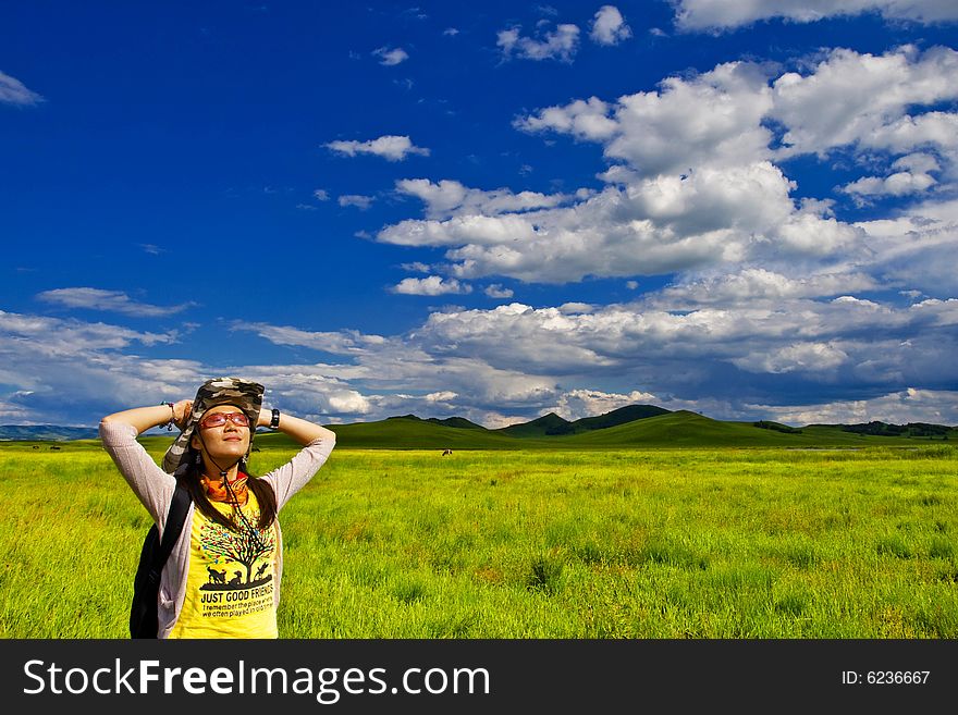 Happy girl on meadow,sky