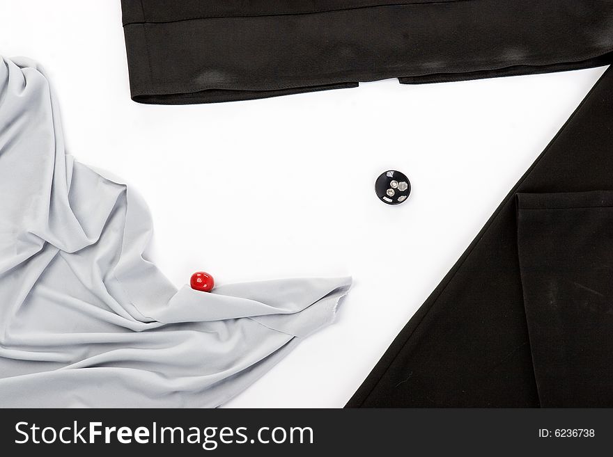 Black button and red sphere over white background
