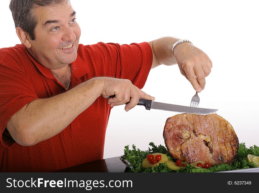 Man slicing a ham isolated on white