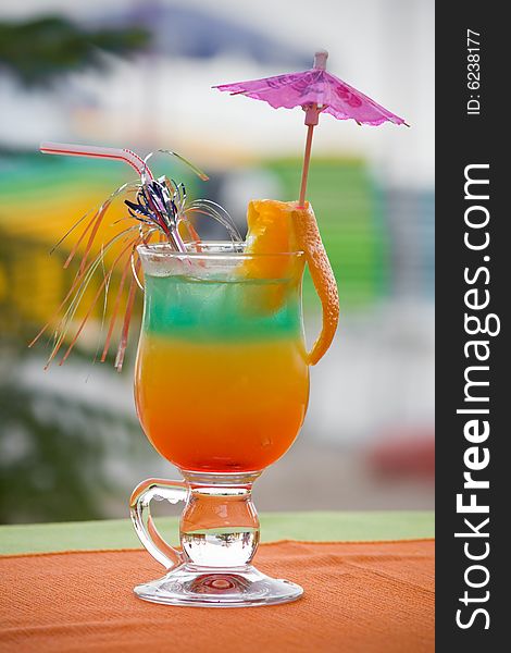 Colored cocktail with orange slice